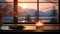 An elegant candle holder on a sill against the evening mountains.