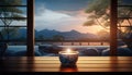 An elegant candle holder on a sill against the evening mountains.