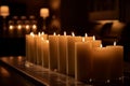 Elegant Candlelight: A Line of Ivory Candles in Glass Cylinders