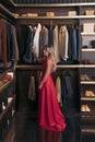 Woman stands in closet Royalty Free Stock Photo