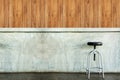 Elegant chair in an empty concrete room. Royalty Free Stock Photo
