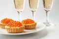 Elegant Champagne Toast with Gourmet Salmon Caviar Tartlets