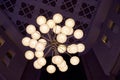 Elegant chandelier on the ceiling of big hall Royalty Free Stock Photo