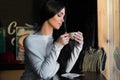 Elegant brunette with cup of coffee