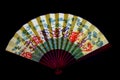Elegant chinese folding paper fan on dark background