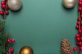 Elegant Christmas banner with copy space decorated with red berries, fir branch, pine cone, gloden baubles Royalty Free Stock Photo