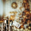 The elegant Christmas coffee set with price tag is on the bokeh Christmas scene Royalty Free Stock Photo