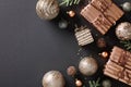 Elegant Christmas flat lay composition with chic copper baubles and gift boxes on dark background. Luxury festive design with copy