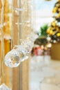 Elegant Christmas New Year decorations crystal balls sparkling in bokeh lights. Festive fir tree in the background Royalty Free Stock Photo