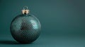 Elegant Christmas ornament showcasing a detailed silver snake scale texture, presented against a minimalist deep teal Royalty Free Stock Photo