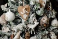 Elegant Christmas tree decorated with a lot of toys: deer, balls, angels and different animals Royalty Free Stock Photo