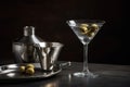 An elegant, classic martini, served in a sophisticated martini glass with a twist of lemon or an olive, accompanied by a silver Royalty Free Stock Photo