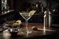 An elegant, classic martini, served in a sophisticated martini glass with a twist of lemon or an olive, accompanied by a silver Royalty Free Stock Photo