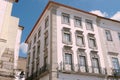 Elegant classical buildings with windows decorated with stucco molding downtown Evora, Portugal