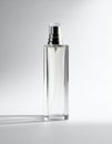 Elegant Clear Glass Perfume Bottle with Silver Sprayer on a White Surface Royalty Free Stock Photo