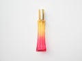 Elegant colored pink with yellow rectangular perfume bottle. Cosmetic container with color gradient. Pink perfume botlle