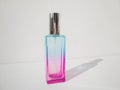 Elegant colored purple with blue rectangular perfume bottle. Cosmetic container with color gradient. Pink perfume botlle