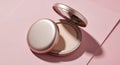 Elegant compact powder makeup with soft lighting and delicate shadows on pink surface Royalty Free Stock Photo