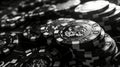 Elegant composition of grayscale casino chips and playing cards against a black background Royalty Free Stock Photo