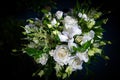 Luxury wedding bouquet on a blue background. Elegant composition of roses. Close-up view of a vibrant flowers