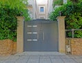 Elegant contemporary apartment building entrance grey metallic door Royalty Free Stock Photo