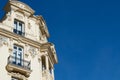 Elegant corner of classical building with different windows and balconies in the centre of Madrid, Spain