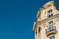 Elegant corner of classy baroque building with windows and balcony downtown Madrid, Spain