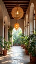 Elegant corridor with woven lanterns and potted plants in spanish colonial style Royalty Free Stock Photo