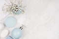 Elegant cosmetics set of accessories for beauty care - soap, towel, soap dispenser and circle pastel blue bowls, silver cosmetic.