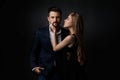 Elegant couple on black background. Royalty Free Stock Photo