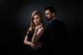 Elegant couple on black background. Royalty Free Stock Photo