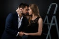 Elegant couple on black background. Royalty Free Stock Photo