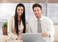 Elegant couple browsing internet at home smiling