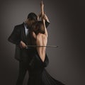 Elegant Couple Kissing. Musician Man with Violin Bow playing Woman Sexy Bare Back. Women Body as Cello. Classical Love Music