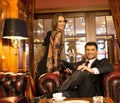 Elegant couple in luxury cabinet Royalty Free Stock Photo