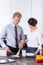 Elegant couple preparing breakfast together Royalty Free Stock Photo