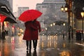 Elegant couple with red umbrella and coat on rainy evening