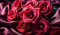 Elegant crimson satin fabric with delicate roses creating a romantic and sensuous mood ideal for luxurious fashion or decor themes