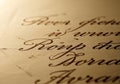 Elegant cursive calligraphy is displayed on aged paper. The ink is a deep brown, creating a classic Royalty Free Stock Photo