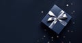 Elegant Dark blue gift box with silver satin ribbon on dark background. Top view of greeting gift with copy space for Christmas Royalty Free Stock Photo