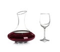 Elegant decanter with red wine and empty glass