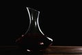 Elegant decanter with red wine on table