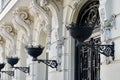 Elegant details on rich facade in baroque style downtown Madrid, Spain