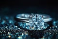 Elegant diamond ring shining on a dark, glittering surface, perfect for showcasing luxury and romance Royalty Free Stock Photo