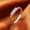 Elegant diamond ring on a soft brown surface. Royalty Free Stock Photo
