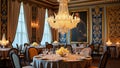 Elegant dining room with luxury chandelier and decorated tables in historic setting Royalty Free Stock Photo