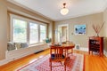 Elegant dining room with window bench with cherry hardwood floor. Royalty Free Stock Photo