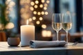 Elegant dinner setting with wine glass, candle, and ambient lighting for a cozy evening Royalty Free Stock Photo