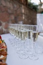 Elegant display of champagne glasses arranged for a wedding toast, sparkling white wine for a celebratory moment