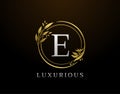 Elegant E Letter Floral Design. Circle Luxury E Gold Logo Icon Royalty Free Stock Photo